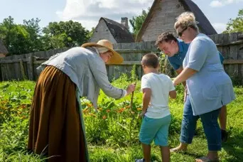 Parents and young son in a garden with a Pilgrim