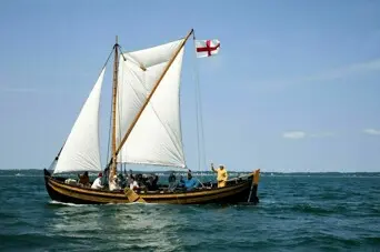Shallop sailing with costumed crew