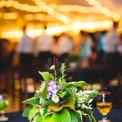 Wedding table setting with a floral arraignment and wine glasses