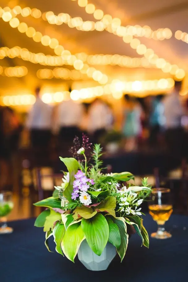 Wedding table setting with a floral arraignment and wine glasses