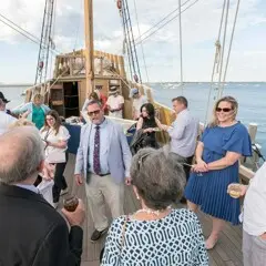 Captain Whit Perry in conversation with guests aboard Mayflower II.