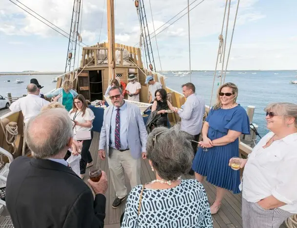 Captain Whit Perry in conversation with guests aboard Mayflower II.