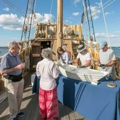 Guests enjoy decks of Mayflower II and raw bar.